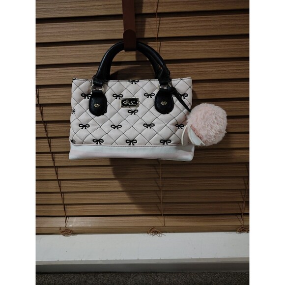 Luv Betsey Handbags - Luv Betsey White Quilted Bow Top Handle Bag with Black Handles, Pom Pom Charm